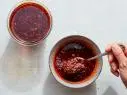 Description: Food Network Kitchen's Chile Crisp. Keywords: Fermented Black Beans, Szechuan Sauce, Cardamom Pods, Star Anise, Cinnamon Sticks, Ginger, Gochugaru, Red Pepper, Kashmiri, Sugar, MSG Powder, Garlic, Onion FNK_CHILE_