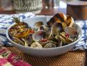 Antonia Lofaso's Steamed Clams with Charred Lemon, Preserved Lemon, Parsley and Calabrian Chili, as seen on Guy's Ranch Kitchen Season 4.