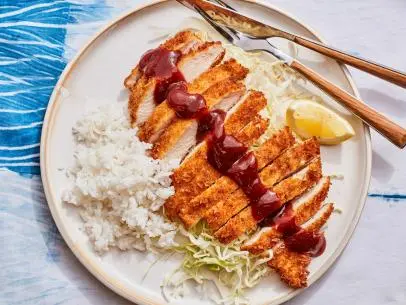 Description: Food Network Kitchen's Chicken Katsu. Keywords: Ketchup, Worcestershire Sauce, Soy Sauce, Eggs, Panko, Chicken Breasts, Cabbage, White Rice, Lemon