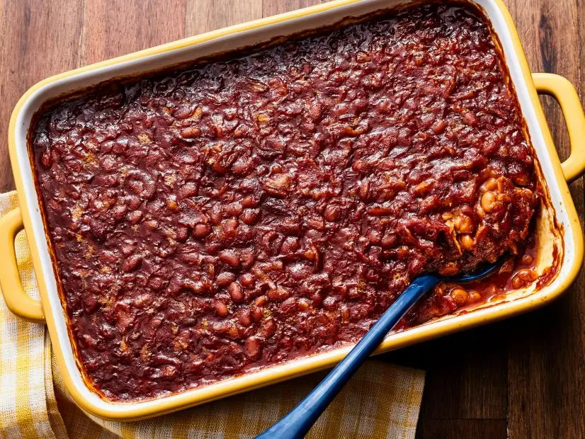 Description: Trisha Yearwood’s Easy Baked Beans. Keywords: Bacon, Vidalia Onion, Pork And Beans, Dark Molasses, Light Brown Sugar, Yellow Mustard