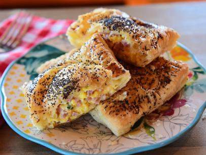 Close-up of Cheesy Ham and Egg Hand Pies, as seen on The Pioneer Woman, Season 27.