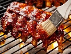 Rack of baby back ribs on the grill.  Please see my portfolio for other food related images.