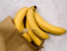 top view fresh bananas in paper bag
