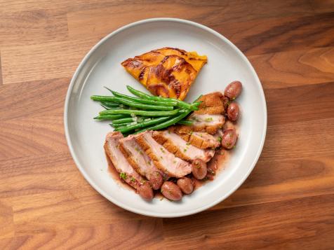 Seared Duck Breast with Roasted Grape and Port Wine Sauce with Sweet Potato Cake and Sautéed Haricot Verts