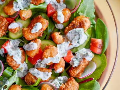 Beauty shot of Molly Yeh's Fried Cheese Curd Salad with Spicy Yogurt Ranch, as seen on Girl Meets Farm, Season 8.