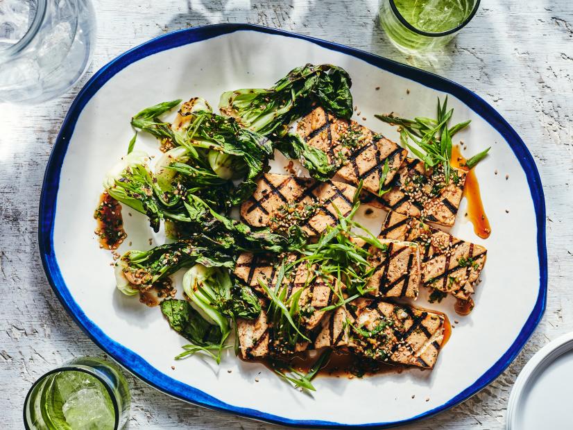 Description: Food Network Kitchen's Grilled Soy, Ginger and Lime Tofu Steaks with Charred Baby Bok Choy.