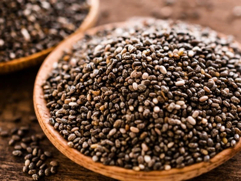 Chia seeds in wooden bowl