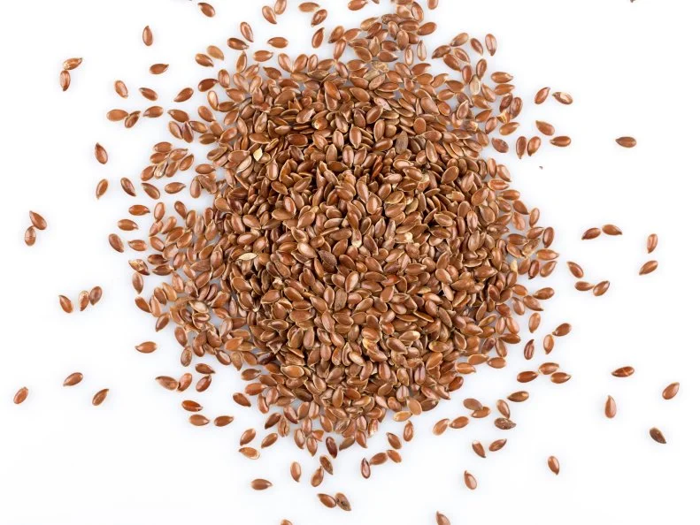 Сlose up of flax seeds isolated on white background