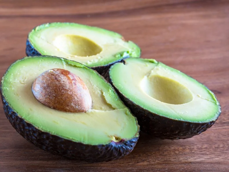 Vibrant colors of a healthy food. Avocados are a great source of vitamins C, E, K, and B-6, as well as riboflavin, niacin, folate, pantothenic acid, magnesium, and potassium.