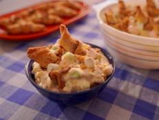 Cookie salad is my favorite of the Midwest dessert salads and it's typically made with fudge stripe cookies, whipped cream, pudding and fruit. Rugelach is a rolled Jewish cookie that's usually filled with jam, chocolate or cinnamon sugar. I got the idea to combine the two when my friends kept calling rugelach "arugula" (they kind of sound the same!), so the whole thing is a play on words and it's really really tasty because the cookies get a little soft, almost cake-like, and the flavors all play so well together.