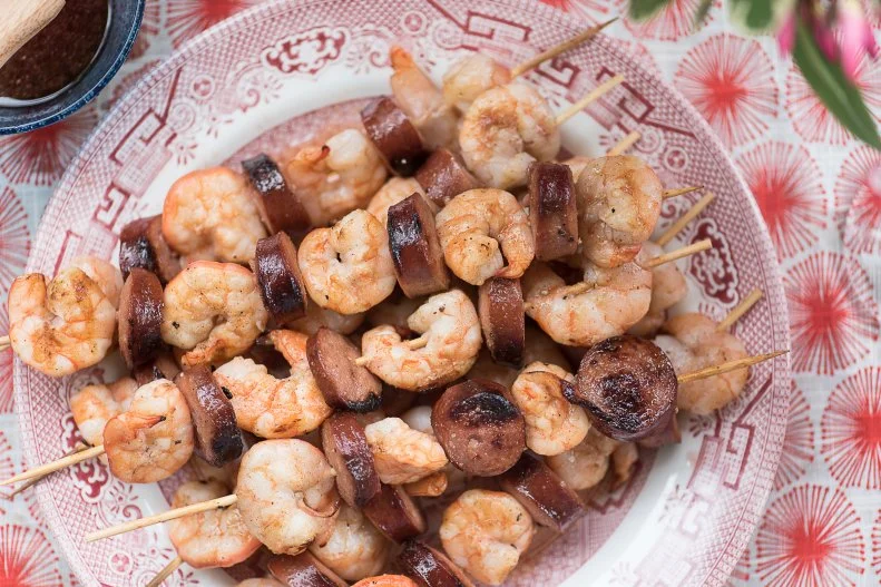 Overhead skewers on a plate, as seen on The Juneteenth Menu