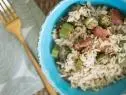 Okra Pilau plated in blue bowl with golden fork, as seen on The Juneteenth Menu