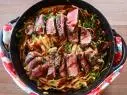 Close-up of Steak and Creamed Greens Pasta, as seen on The Pioneer Woman, season 27.