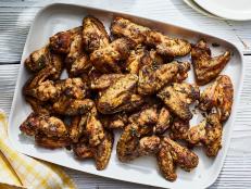 Grilled chicken wings are the quintessential finger food for a summer cookout with family and friends. Just toss the chicken in a flavorful rub, then grill to golden brown perfection. A final toss with Cajun lemon-pepper seasoning adds a kick of spice and acidity.