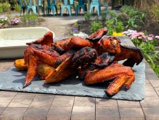These wings follow the formula for the best summer food: a simple marinade, a tasty dip, and cooking over charcoal.