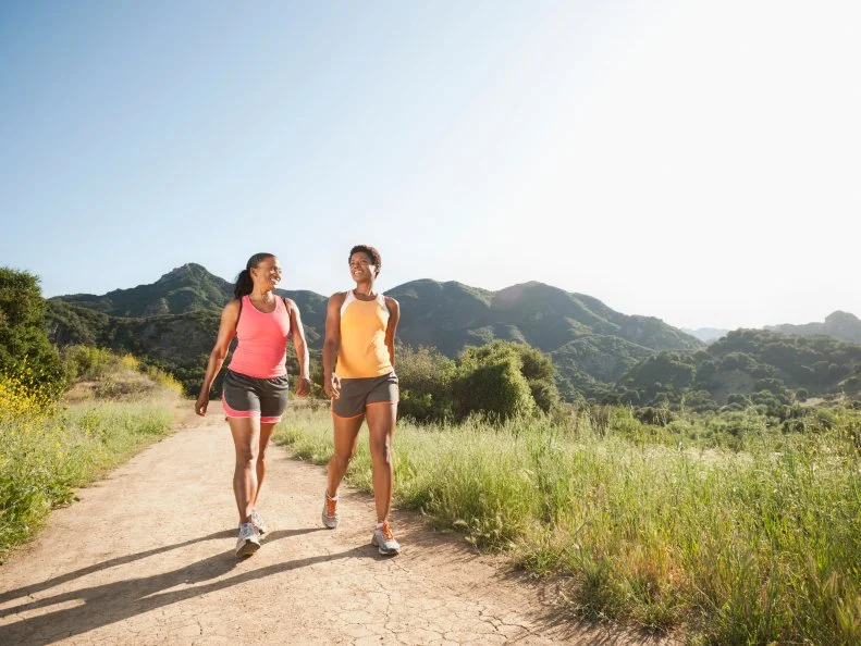 Two Women Going for a Hike on a Nature Trail