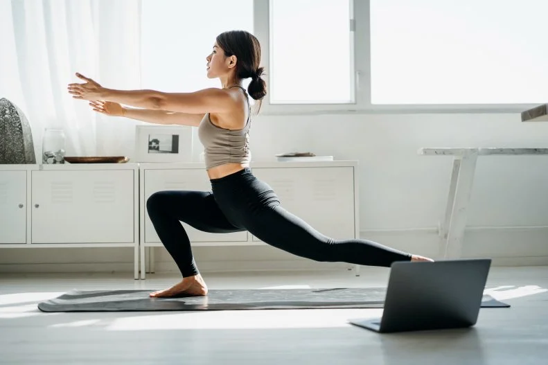 Woman Following Online Yoga Class