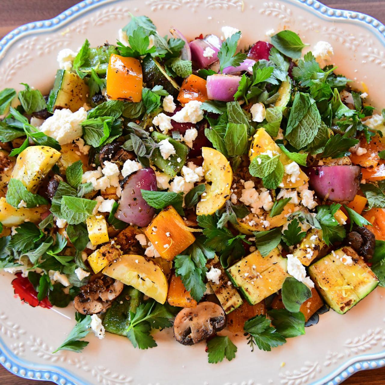 https://food.fnr.sndimg.com/content/dam/images/food/fullset/2021/06/28/WU2805_-Big-Grilled-Veggie-Salad_s4x3.jpg.rend.hgtvcom.1280.1280.suffix/1624904632802.jpeg