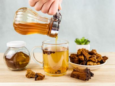 https://food.fnr.sndimg.com/content/dam/images/food/fullset/2021/06/fn_chaga-mushroom-tea-getty_s4x3.jpg.rend.hgtvcom.406.305.suffix/1618258397186.jpeg