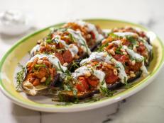 I created some eggplant parmesan boats on The Kitchen recently and people really seemed to love them, so I thought, why not create an eggplant boat with a summery twist? The Mediterranean spices here taste just right on a steamy summer night.
