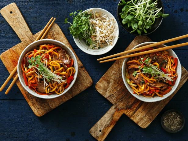Bowls with chicken, beef and vegetables chow mein