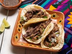 Traditional mexican slow cooked lamb tacos also called barbacoa on white background