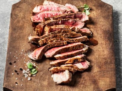 https://food.fnr.sndimg.com/content/dam/images/food/fullset/2021/08/06/sliced-steak-on-cutting-board.jpg.rend.hgtvcom.406.305.suffix/1628249872290.jpeg