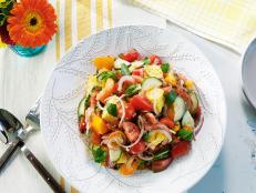 When serving a crowd, I'm always thinking of recipes that can be fully or partially made ahead. That's why this panzanella is so great. The traditional bread salad was a way to use up stale or leftover bread. I thought it would be fun to add a Southern spin and substitute day-old cornbread and toast it in bacon drippings. Sounds yummy right? Well, it is!