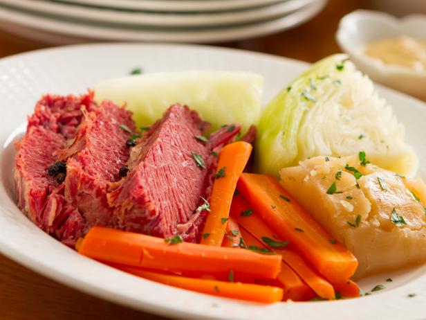 A classic boiled dinner of corned beef, cabbage, potatoes, onions, and carrots.