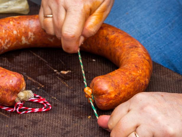 FEBRUARY 2020 - Pelabravo, Salamanca, Castilla LeÃ³n, Spain - Families formerly gathered to do the traditional slaughter of the pig. In the traditional pig slaughter, they sacrificed one or several pigs and they split it and minced pieces of meat to make the traditional Spanish chorizo, salchichÃ³n, lomo embuchado and jamÃ³n. Today that tradition has been recovered as a traditional festival and in the province of Salamanca it is celebrated in many villages throughout the winter.  The chorizo is a traditional Spanish meal made with pork seasoned with paprika and other spices that are introduced into a piece of pork intestine