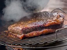 Fresh smoked Texas bbq brisket on the grill