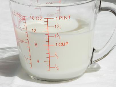 https://food.fnr.sndimg.com/content/dam/images/food/fullset/2021/08/23/pyrex-measuring-cup-half-and-half-white-surface.jpg.rend.hgtvcom.406.305.suffix/1629753212810.jpeg