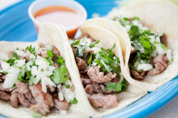 Mexican food: three gourmet steak tacos garnished with onions and cilantro. You might also be interested in these: