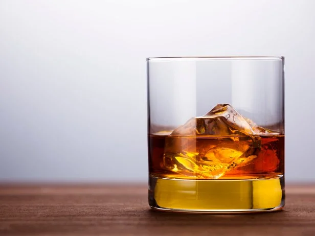 Whisky in wooden background