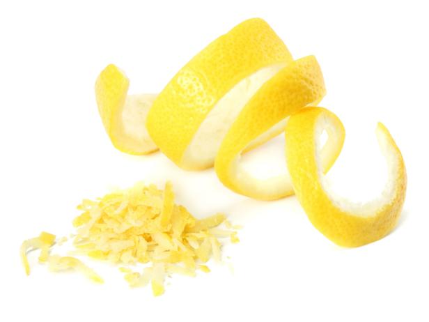 fresh lemon peel and lemon zest isolated on white background. healthy food