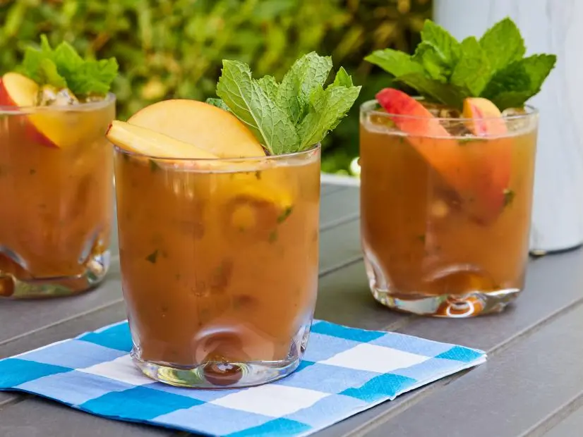 Description: Stephanie Gravalese's Peach and Muddled Mint Tea Punch.