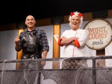 Mentors Michael Symon and Anne Burrell react as they watch the recruits cook during the baseline challenge, as seen on Worst Cooks in America Halloween Special.