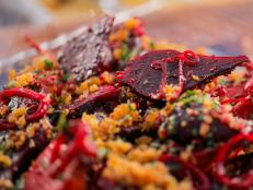 I love this recipe for traveling because I can marinate the beets ahead of time and they hold up well. You can then bring along accompaniments on the side, that add new elements, like crunch, and add them to make the final dish later. In this recipe I use harissa, a North African chile paste made from sun-dried chiles. I like to use it because it has an approachable chile flavor without all the heat.