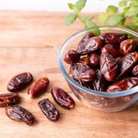 Juicy dates on a old wooden table