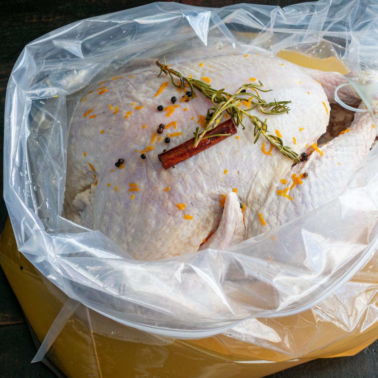 https://food.fnr.sndimg.com/content/dam/images/food/fullset/2021/09/16/17/raw-turkey-brining-bag-spices-wood-surface.jpg.rend.hgtvcom.1280.1280.suffix/1631912575141.jpeg