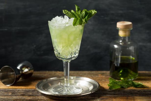 Boozy Refreshing Absinthe Frappe Cocktail with Ice and Mint