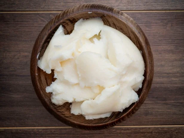 Pork fat in wooden plate, top view
