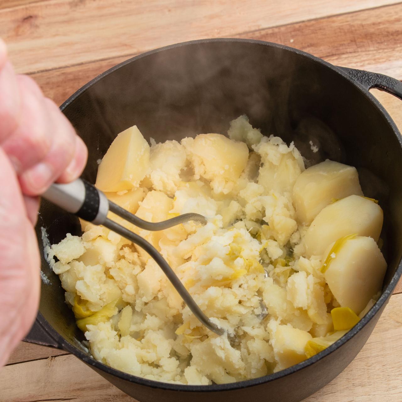 Use Your Potato Masher To Break Up Ground Meat in the Skillet