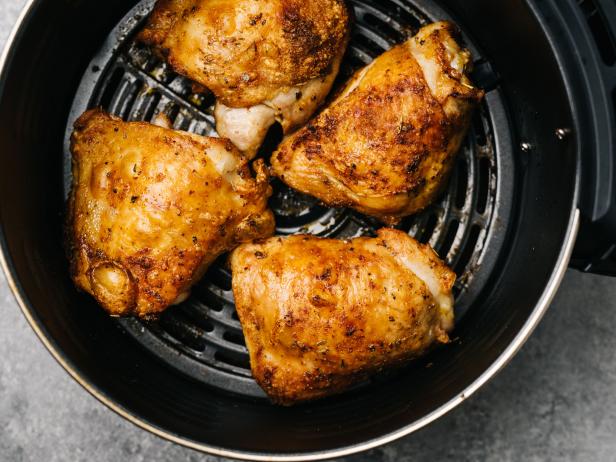Four spicy air fried chicken thighs in an air fryer in Frederick, MD, United States
