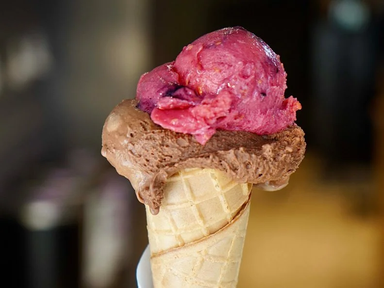 A cone of chocolate and raspberry gelato from Otaleg, as seen on Bobby & Giada In Italy, Season 1.