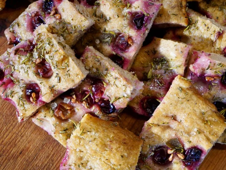Foccaccia with grapes and rosemary made by Giada De Laurentiis and chef Giancarla Bodoni at Monteverdi in Tuscany, Italy, as seen on Bobby & Giada in Italy, Season 1.