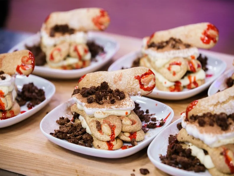 Renee Loranger's Terror-Misu made with Amaretto Coffee Soaked lady fingers and a cream cheese mascarpone filling, chocolate almond feuilletine and blood orange drizzle, as seen on Halloween Baking Championship, Season 7.