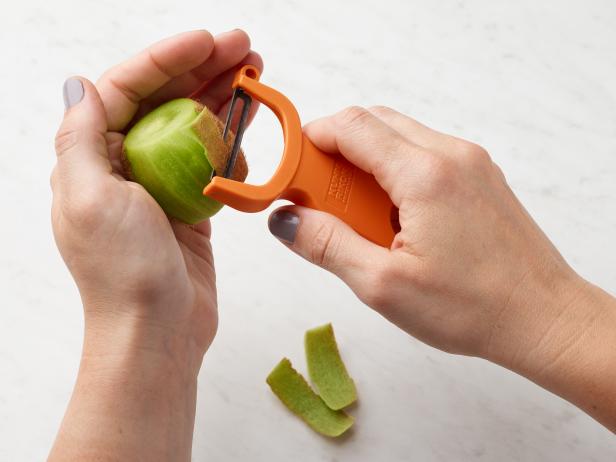Food Network Kitchen’s How to Peel a Kiwi With a Vegetable Peeler, as seen on Food Network.