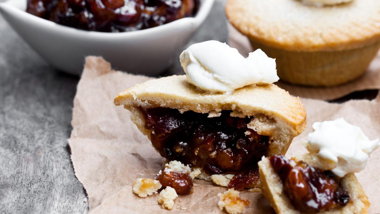 https://food.fnr.sndimg.com/content/dam/images/food/fullset/2021/10/11/mincemeat-pies-white-bowl-paper-grey-surface.jpg.rend.hgtvcom.1280.720.suffix/1633995911365.jpeg