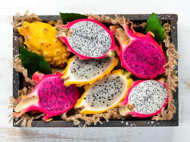 Dragon Fruit in Wooden Box. Pitahaya Tropical Fruits. Top view. Free space for text.